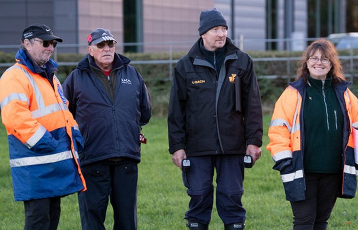A group of male and female endurance officials