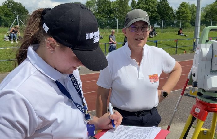 Field officials with EDM machine